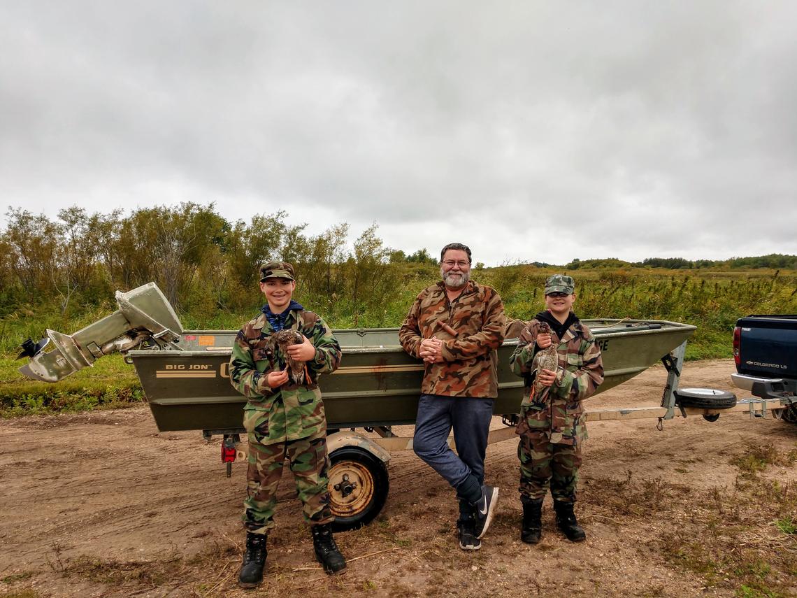 John Williams and grandchildren Seth (left) and Esther enjoy a northwest Minnesota duck hunt at Thief Lake Wildlife Management Area near Middle River, Minn., in the fall of 2020. Seth's duck was banded, and Esther's duck was her first, said Williams, who retired Tuesday, Aug. 3, as Northwest Region 1 wildlife manager for the Minnesota Department of Natural Resources in Bemidji. (Contributed/ John Williams)